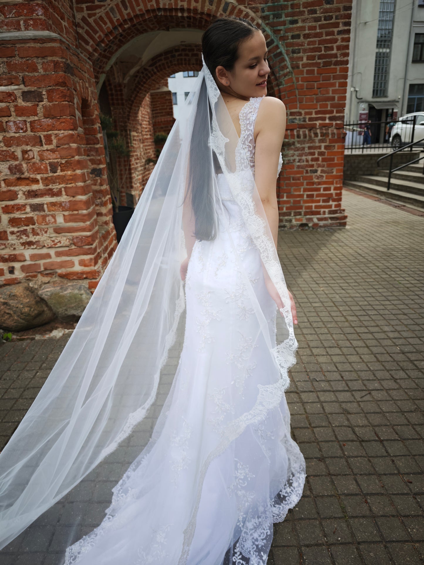 The Paloma Veil – bridal mantilla veil with full perimeter Chantilly lace, three-quarter view, ivory, made to order