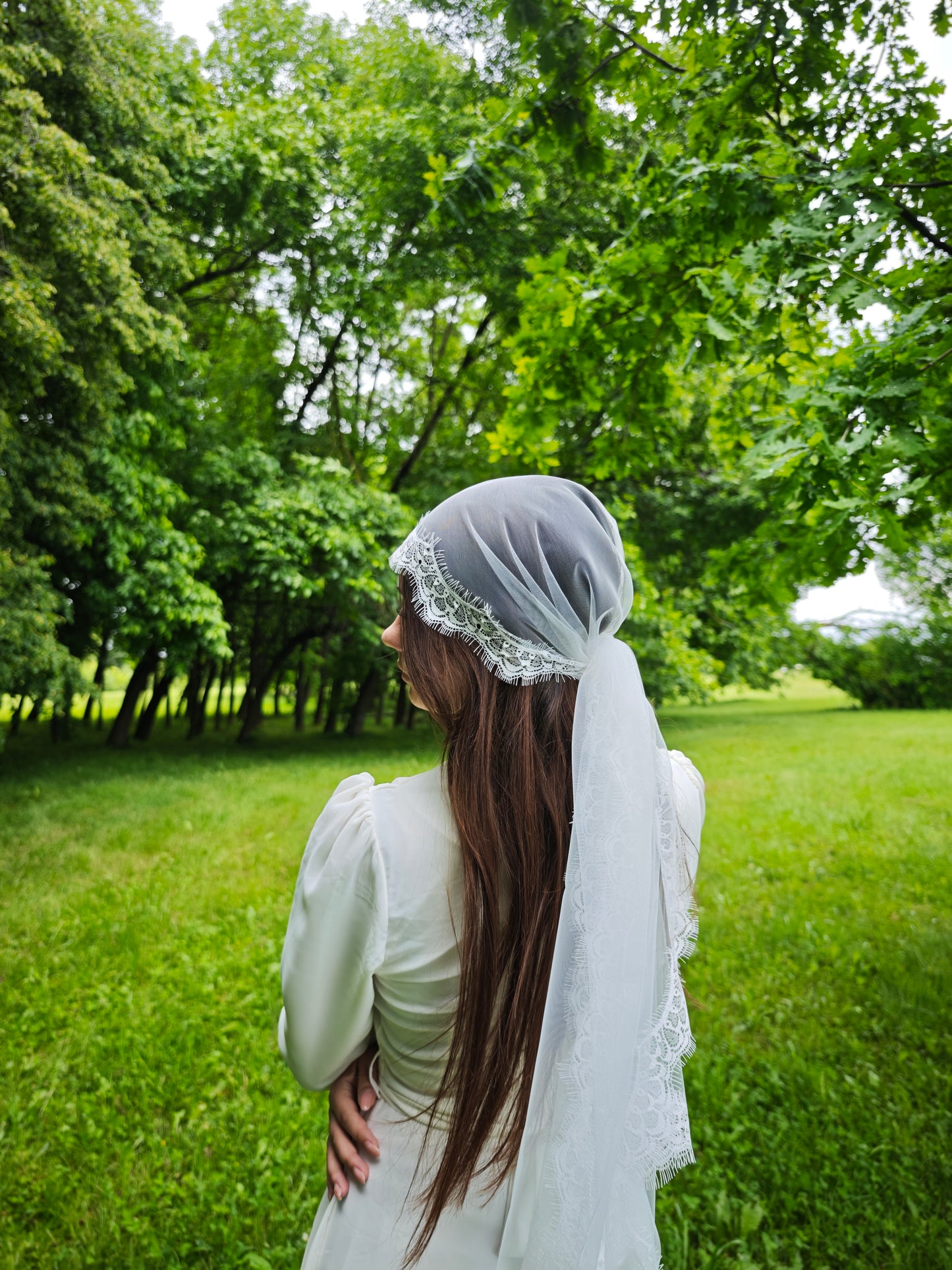 Romantic ivory lace bandana veil styled for a boho garden wedding