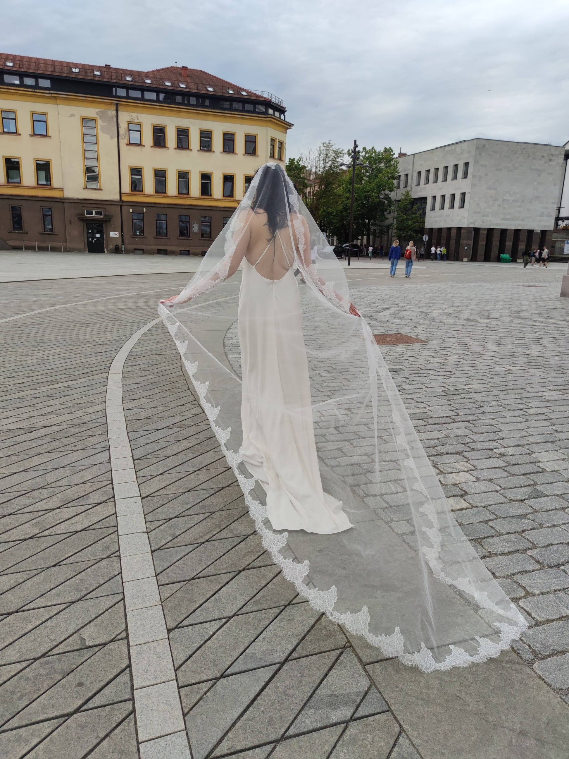 Light ivory mantilla wedding veil with scalloped floral Chantilly lace edge, The Laima veil, side view