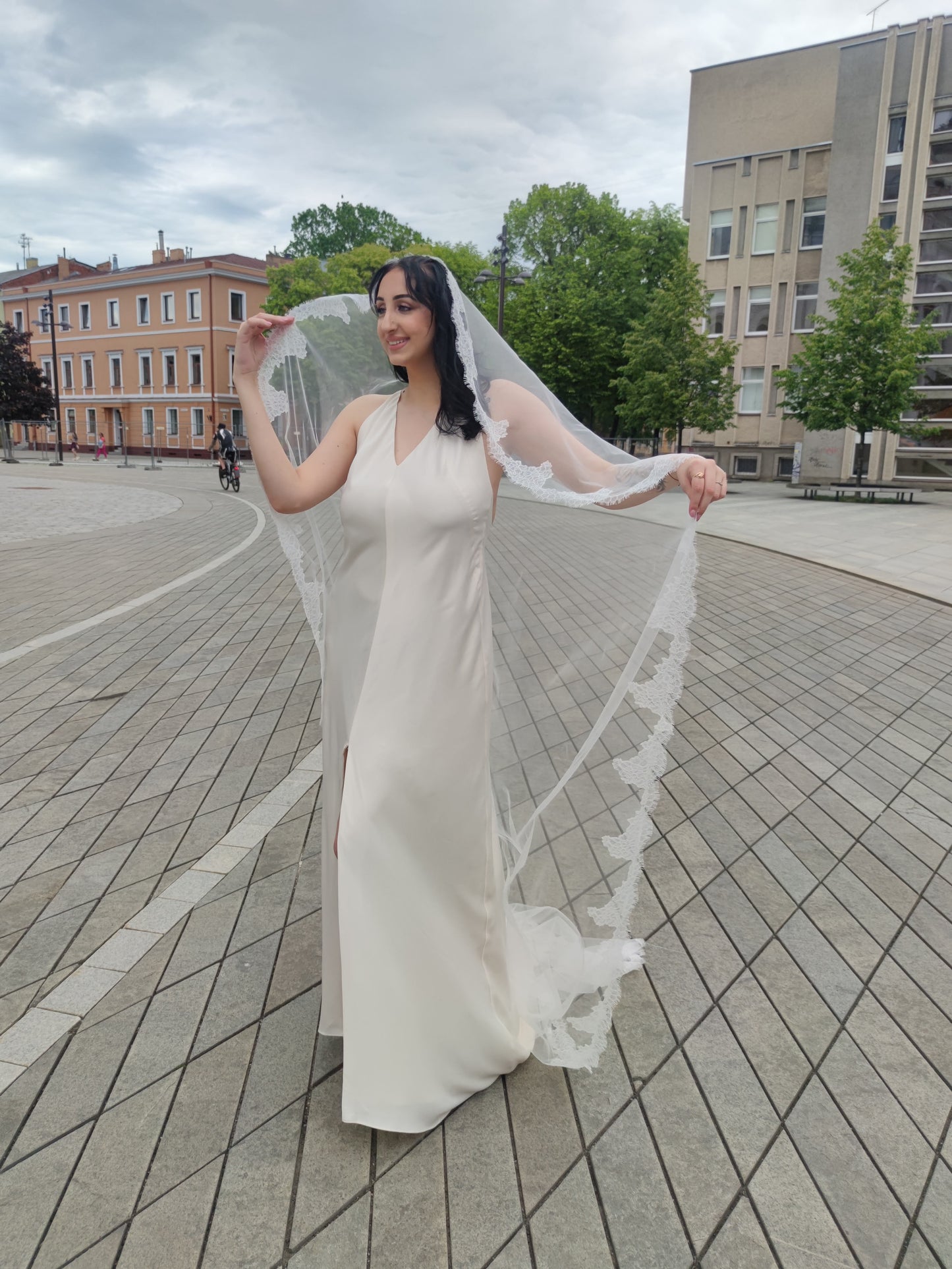 Scalloped floral Chantilly lace edge detail of The Laima light ivory mantilla wedding veil