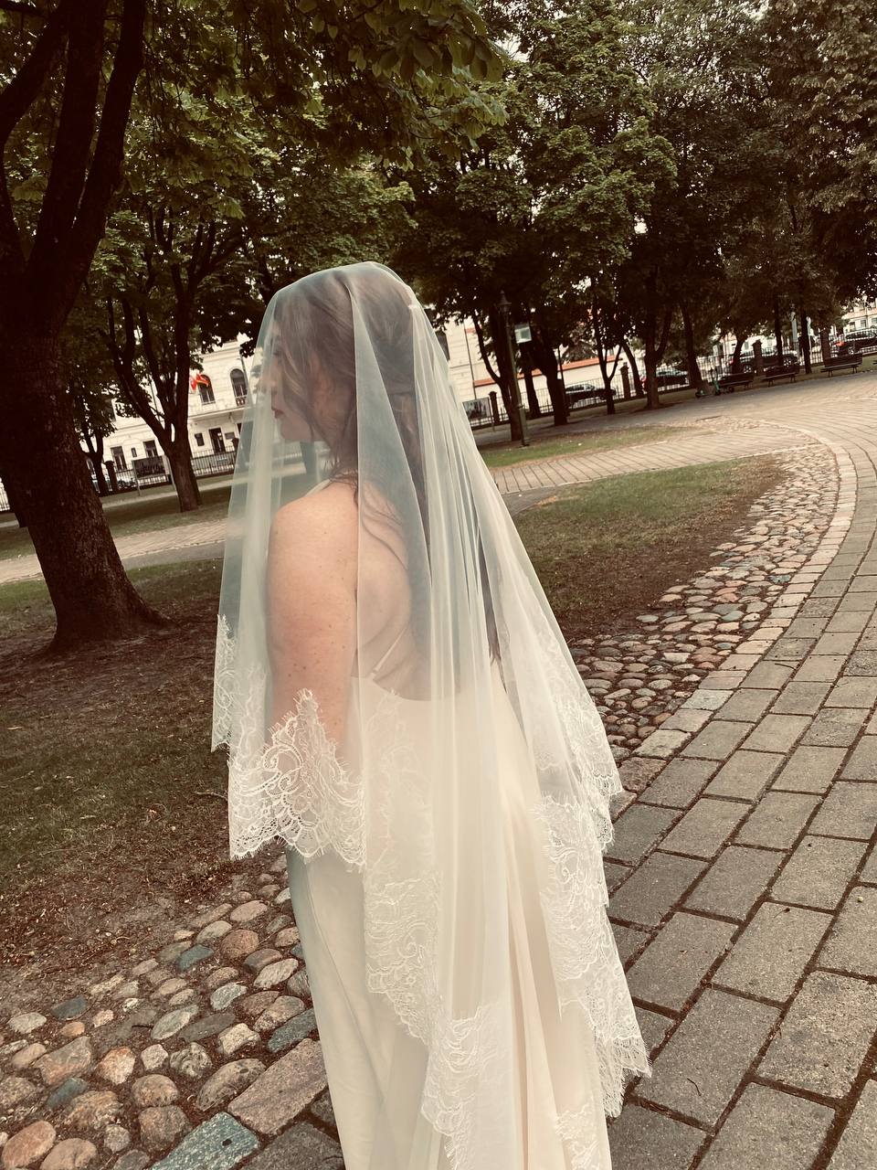 Two-tier blusher veil in light ivory, both layers with Chantilly lace, side view