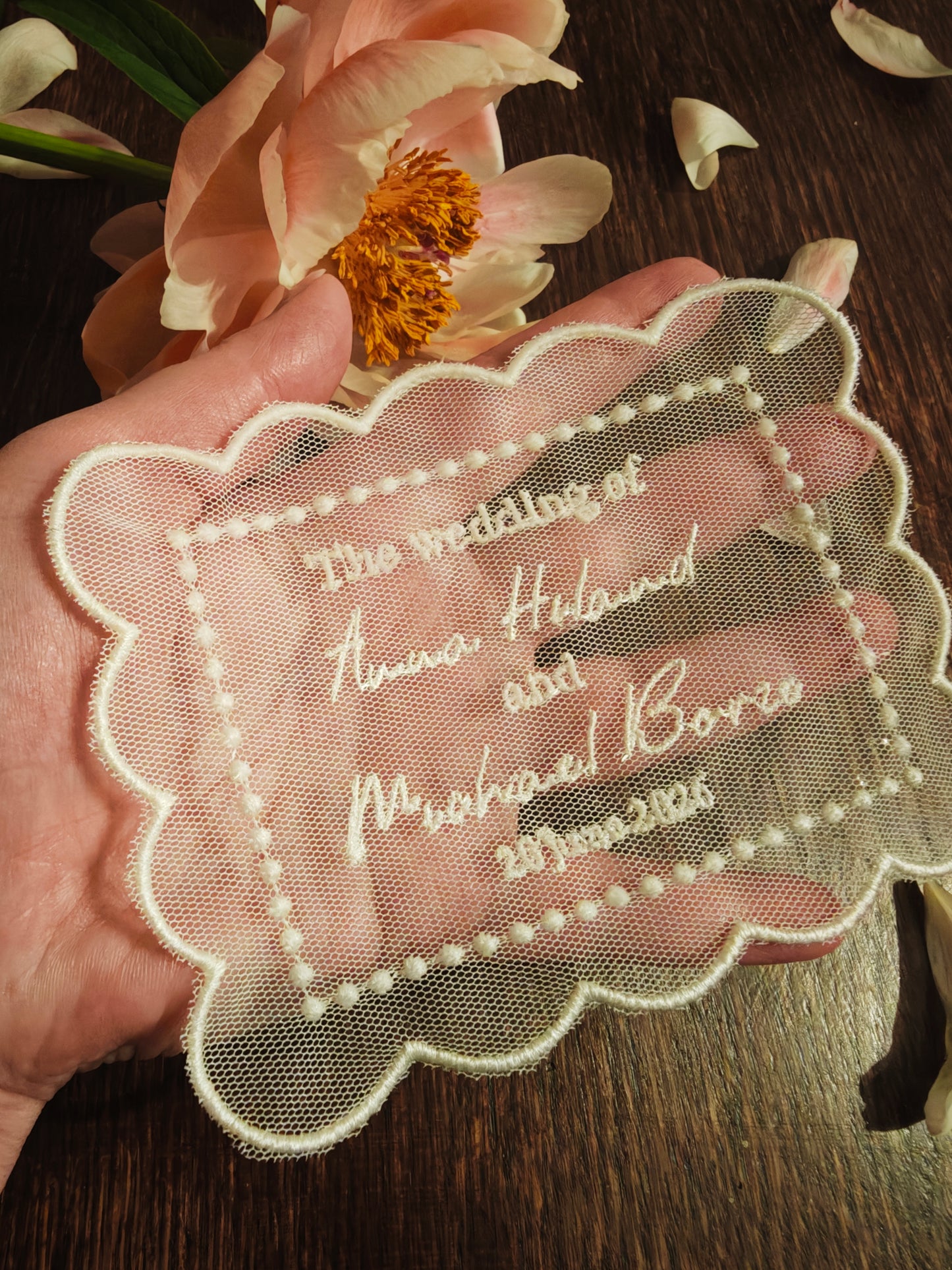 Handmade tulle wedding invitation with machine embroidered names and date, ivory
