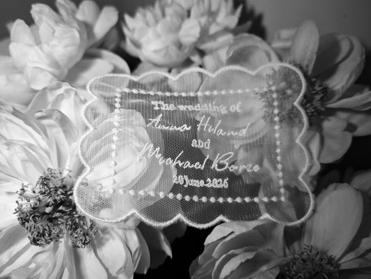Tulle wedding invitation with embroidery, personalized names and date, ivory, flat lay