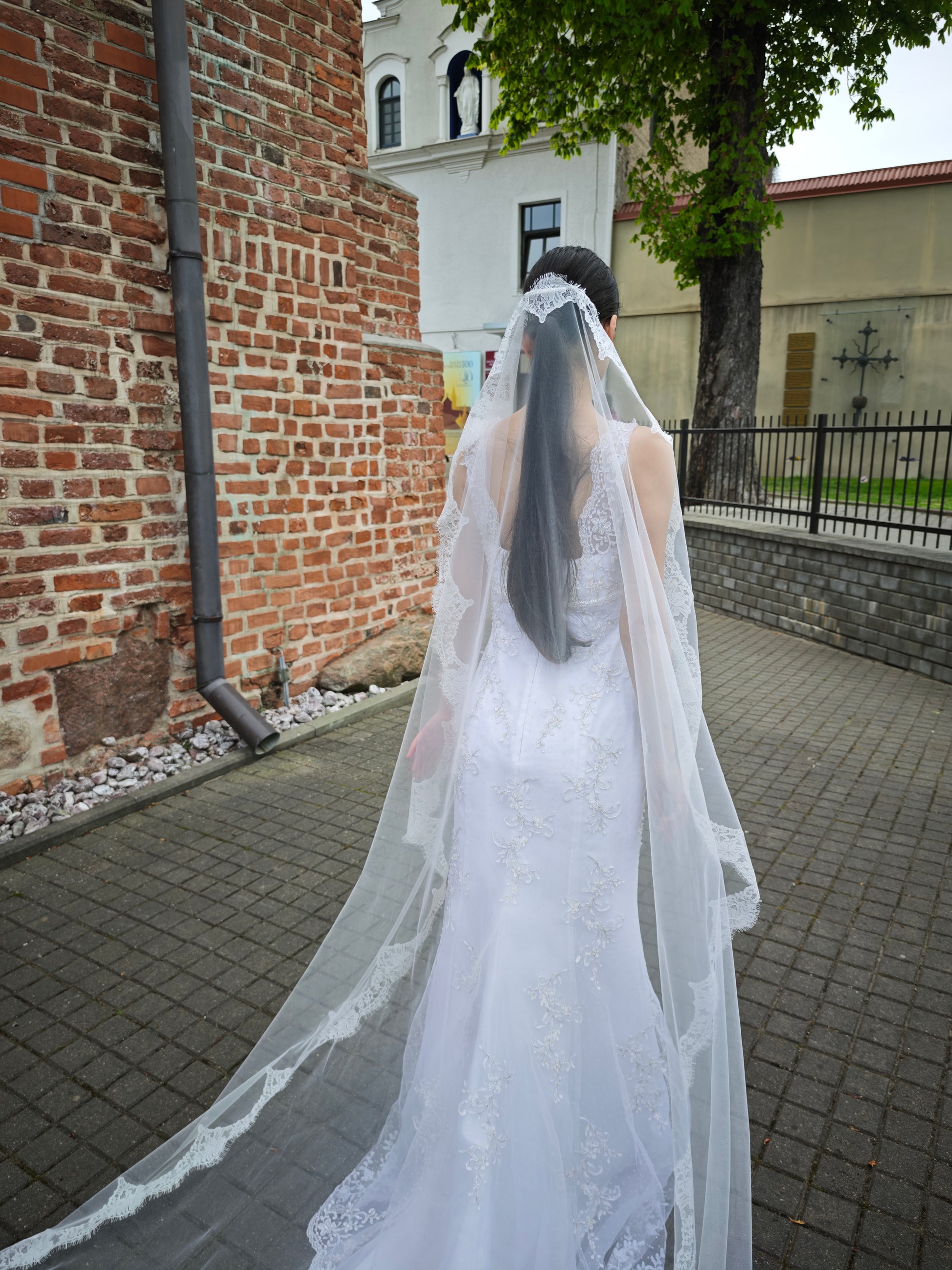 Handcrafted Chantilly lace mantilla veil with lace running down both sides, cathedral length, European atelier bridal veil