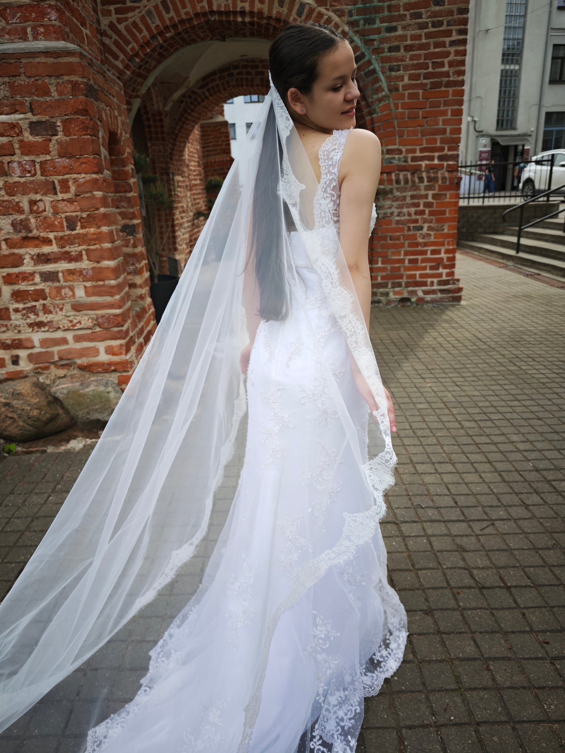 The Paloma Veil – bridal mantilla veil with full perimeter Chantilly lace, three-quarter view, ivory, made to order