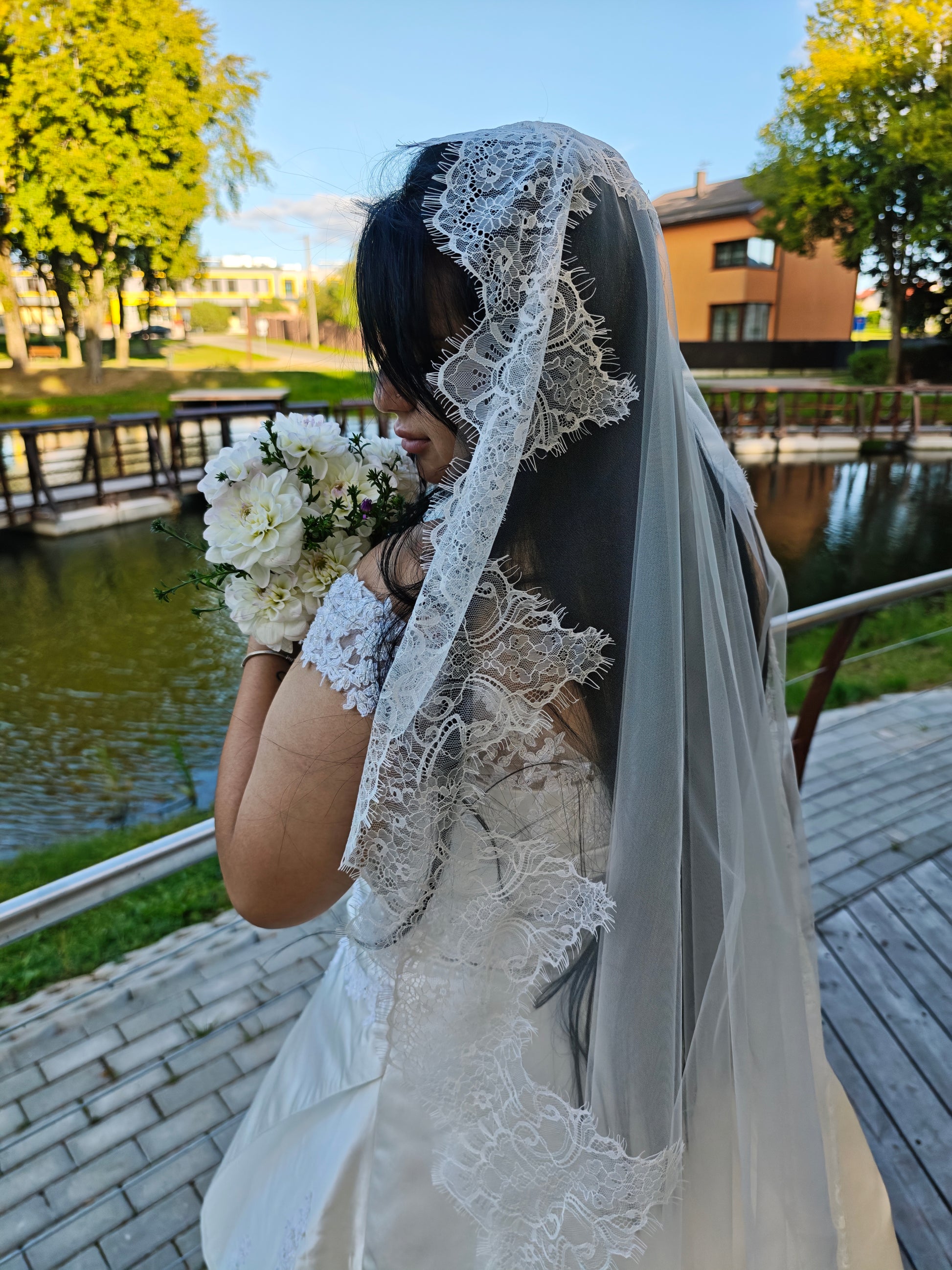 Light ivory mantilla veil with hand-sewn Chantilly lace border, side view