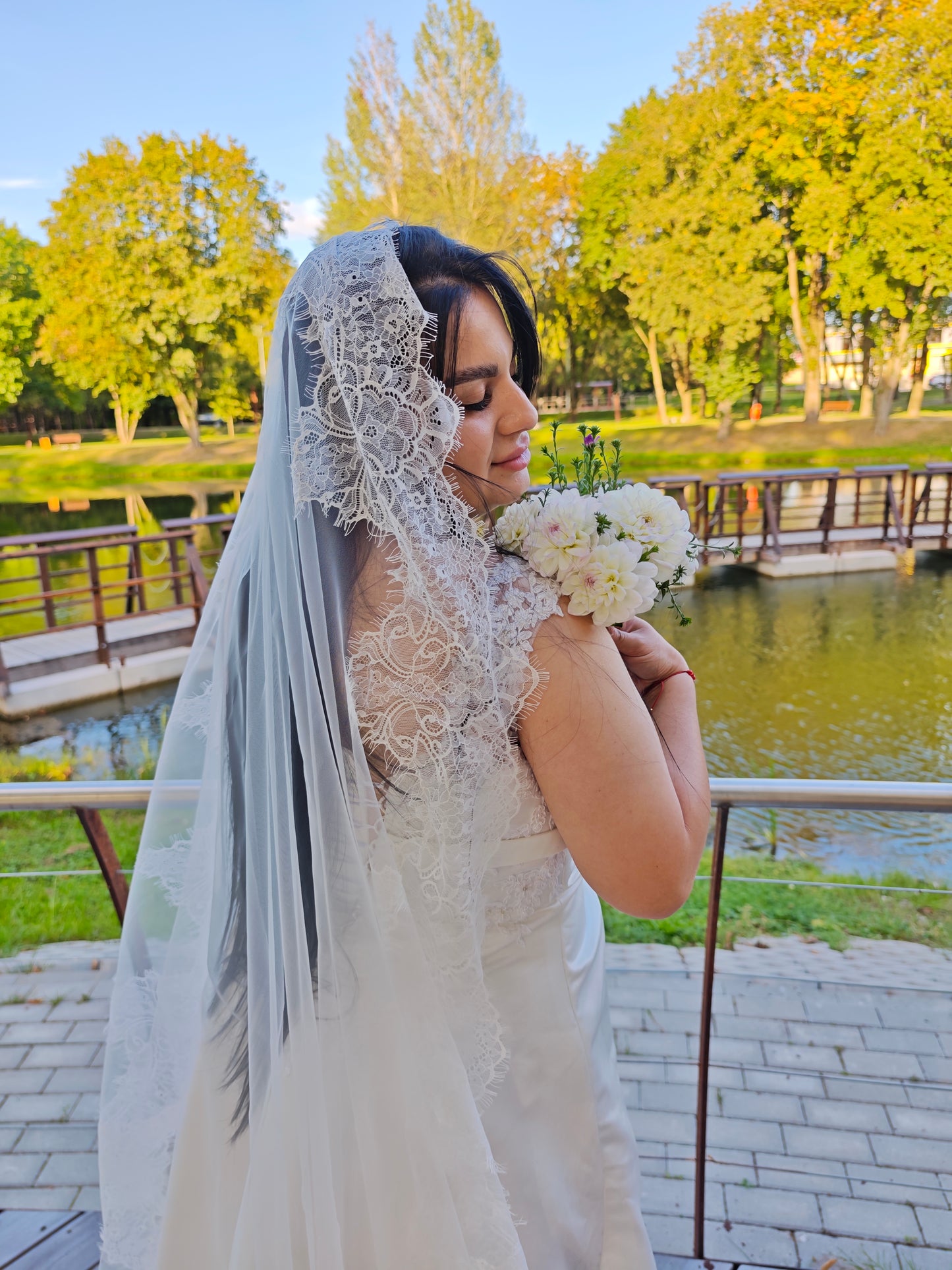 Chantilly lace mantilla veil in light ivory, hand-sewn French lace, back view