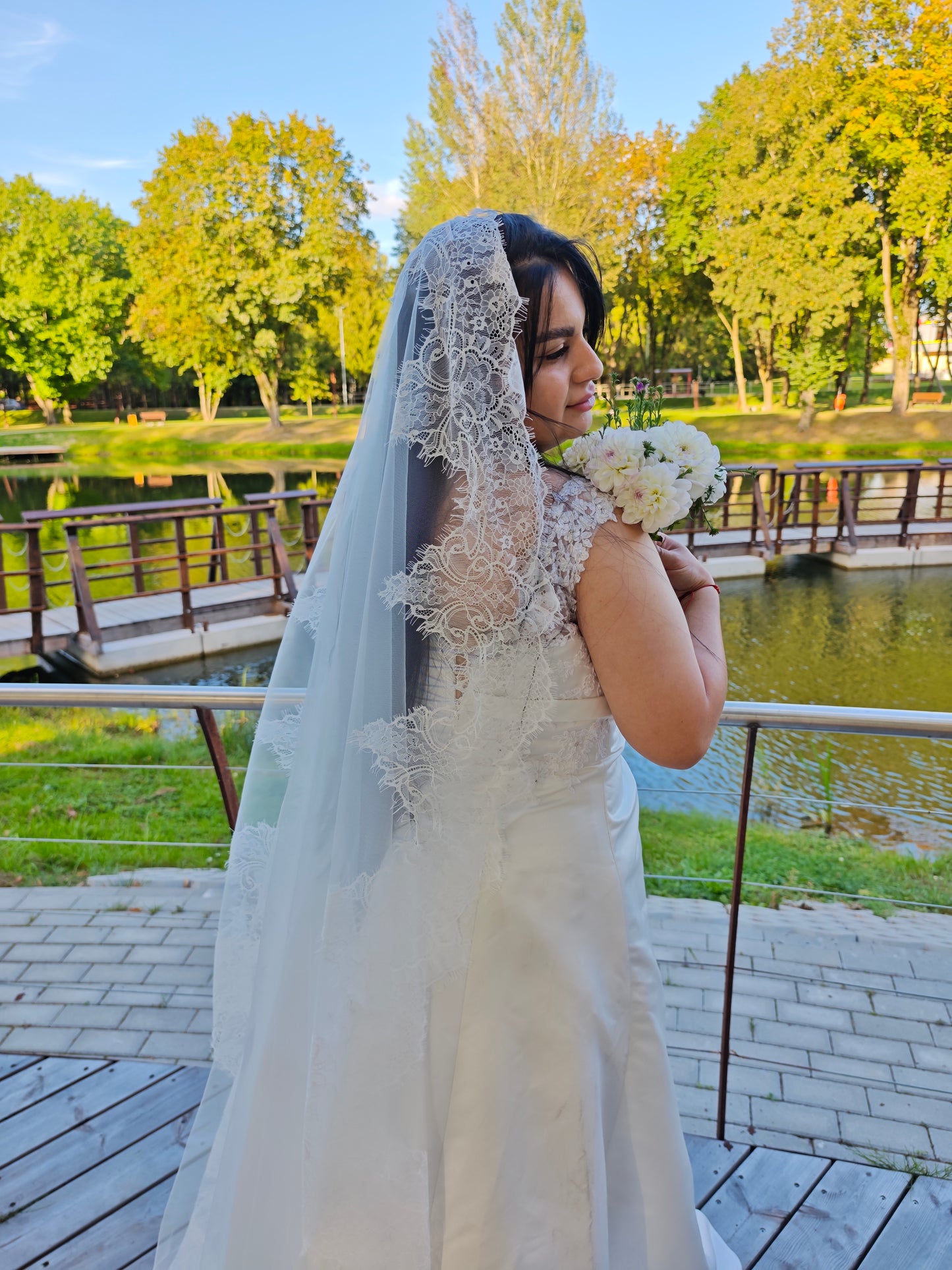 Hand-sewn French lace mantilla veil, ivory, close-up of lace stitching
