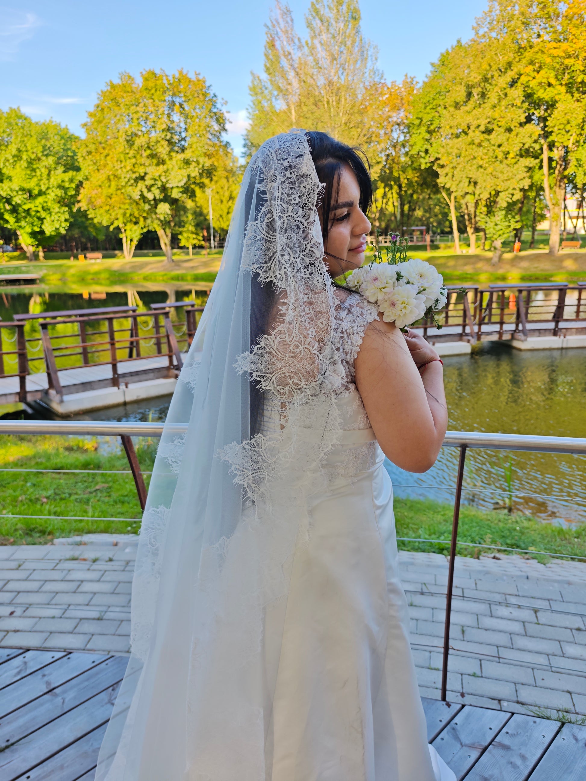 Hand-sewn French lace mantilla veil, ivory, close-up of lace stitching