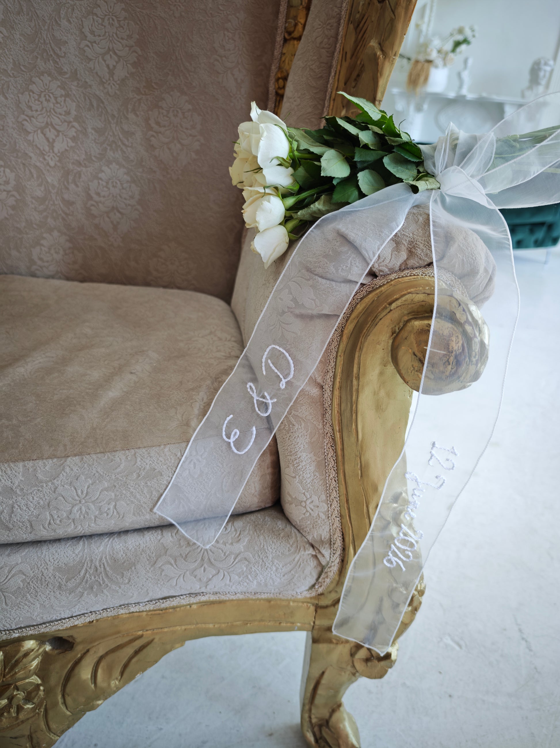 Custom ivory organza ribbon with machine embroidery, wedding accessory, draped view