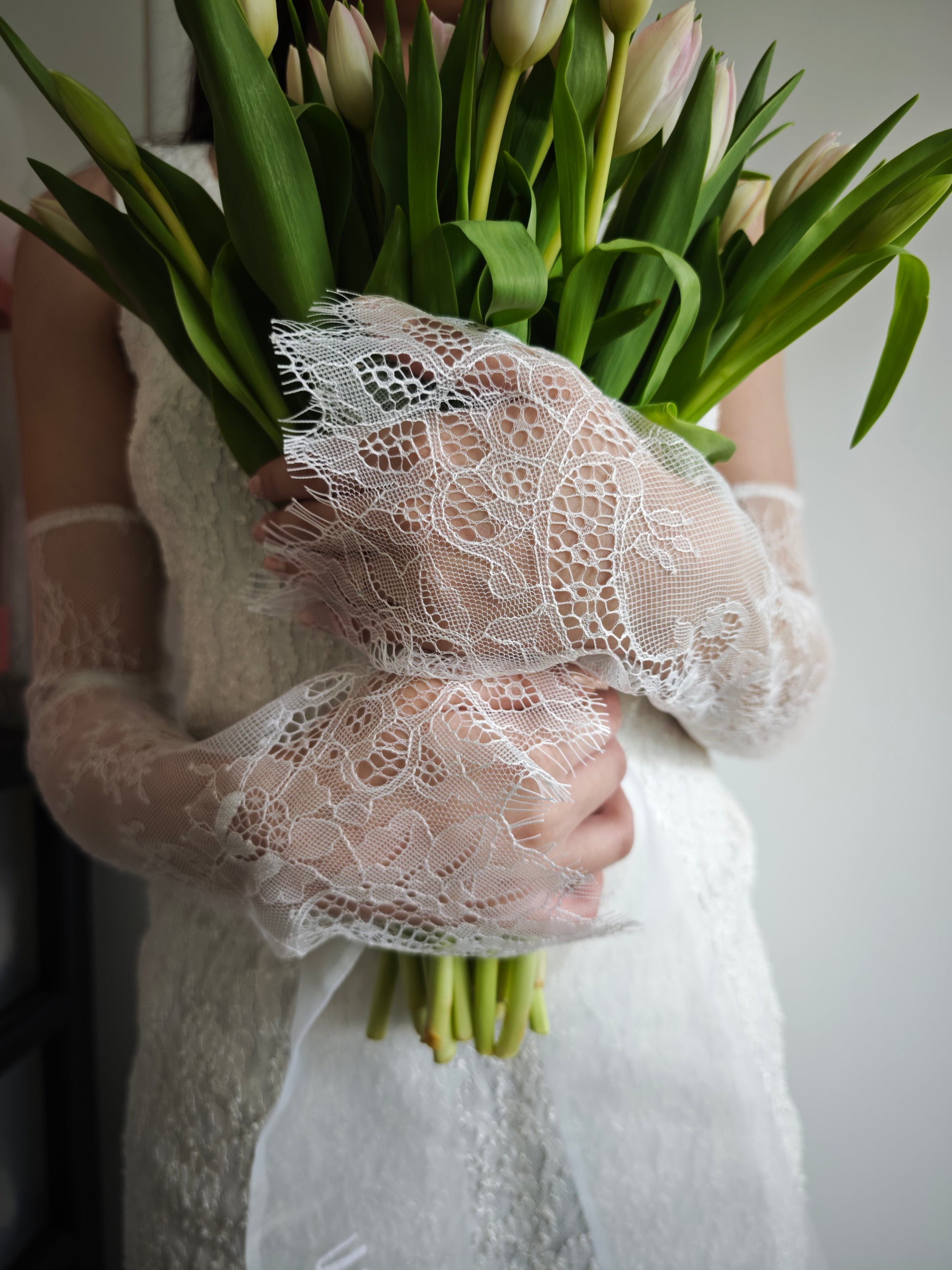 Ivory lace bridal arm sleeves, fingerless, Chantilly lace, side view on model