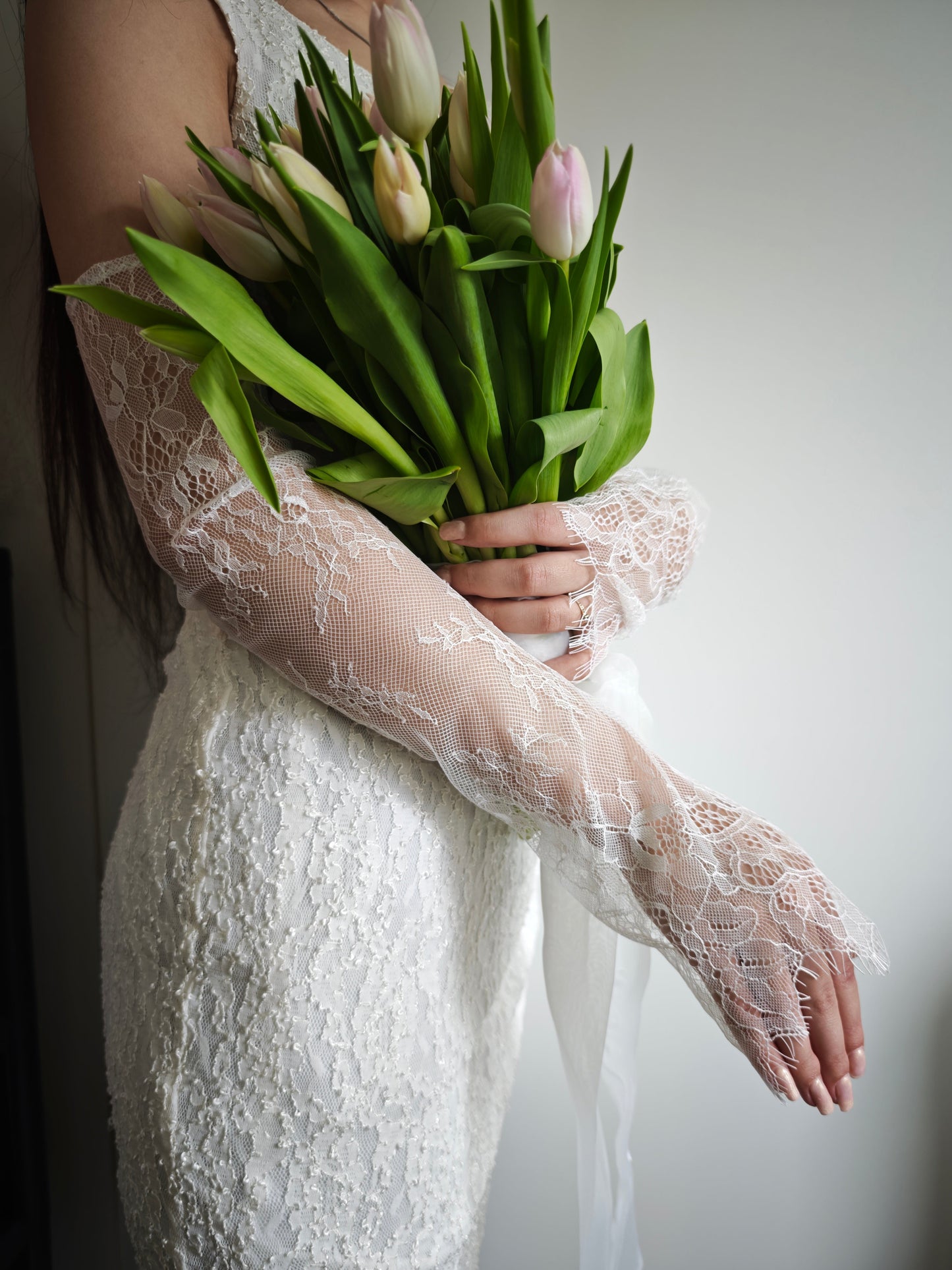 Chantilly lace fingerless wedding gloves, ivory, lace pattern detail close-up