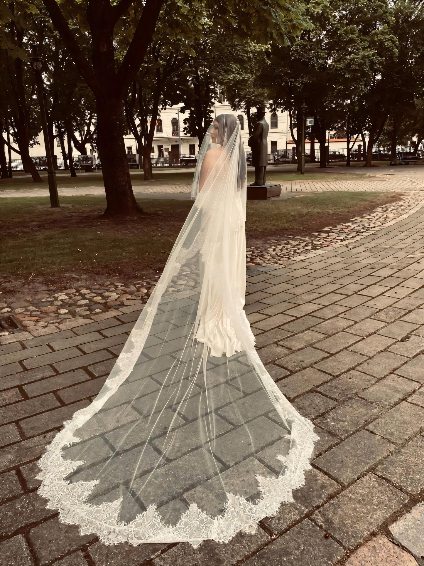 Cathedral length two-tier blusher veil in light ivory, French Chantilly lace border on both layers, handmade bridal veil